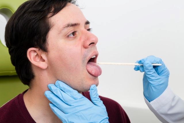 A healthy tongue typically a fleshy pink color.