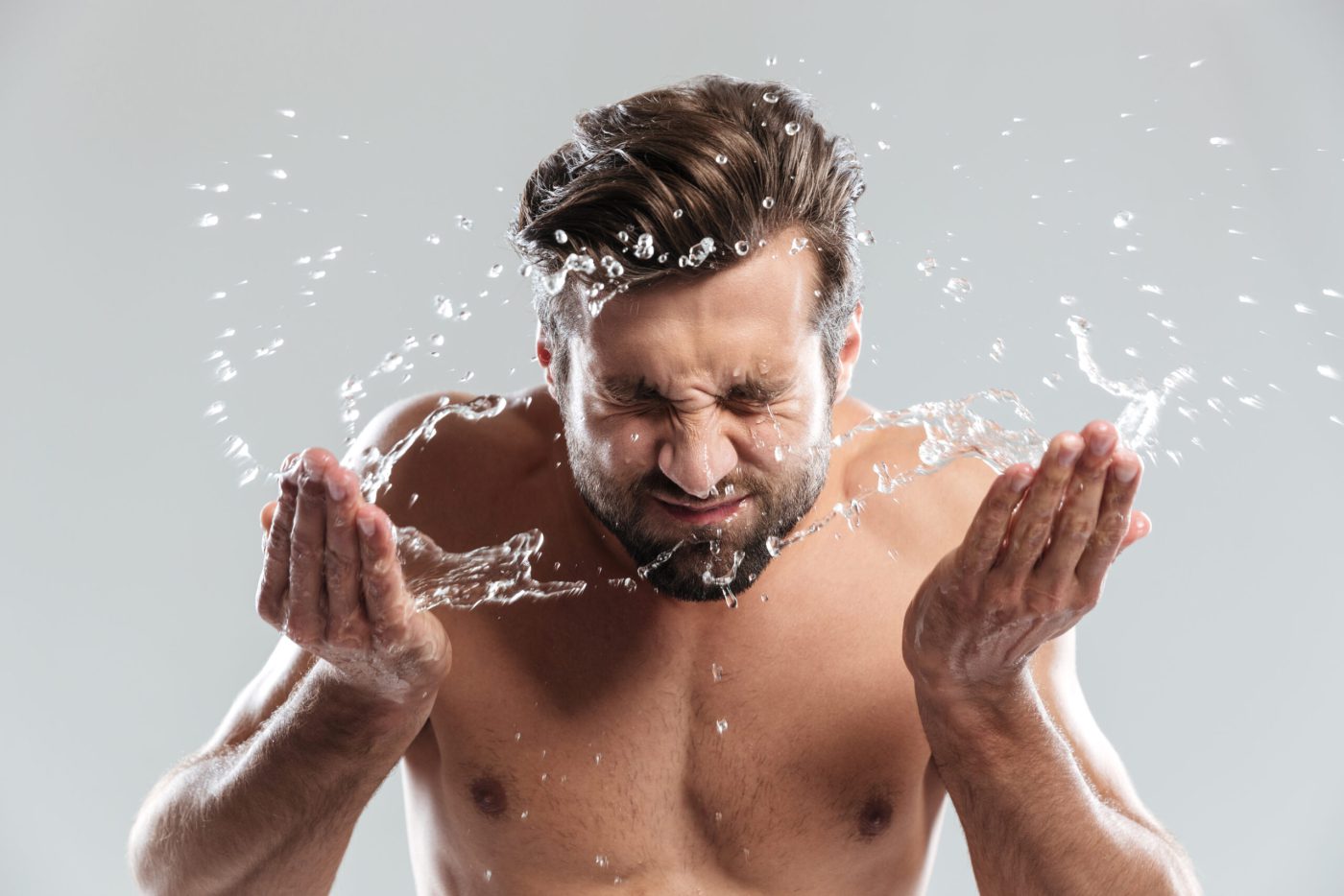 men is washing his face