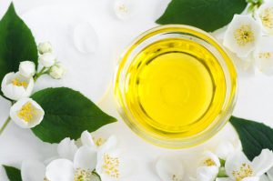 Hair oil bowl and white flowers 