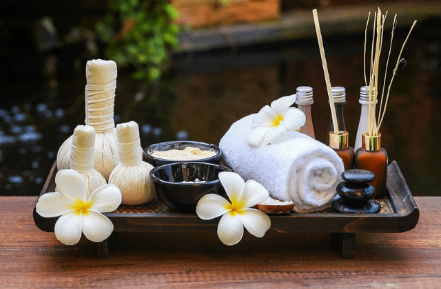 Herbal oils, flowers, towel and tray