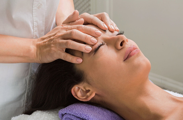 lady is getting head massage