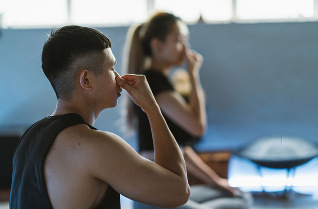 lady and men are doing pranayama 